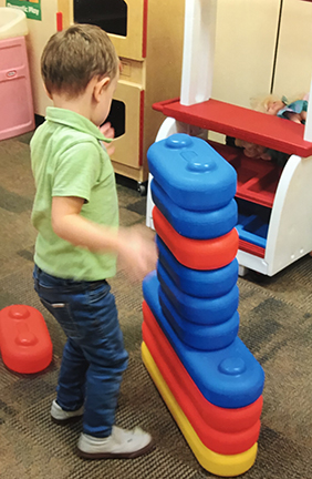 boy playing in classroom