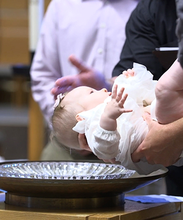 close-up of a baby being baptized