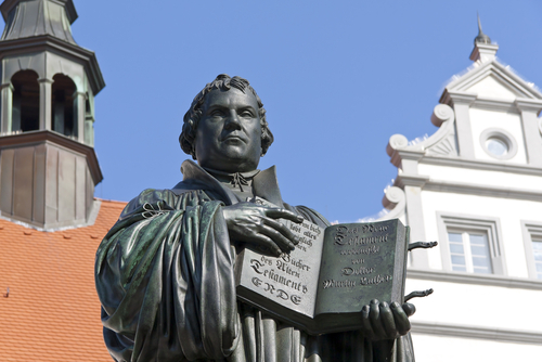 Statue of Martin Luther holding the 95 theses.