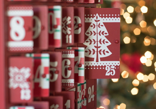 A wooden advent calendar counts down the days until Christmas.