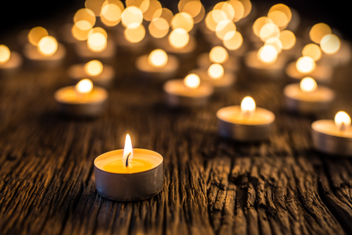 Tea light candles lit to symbolize hope.