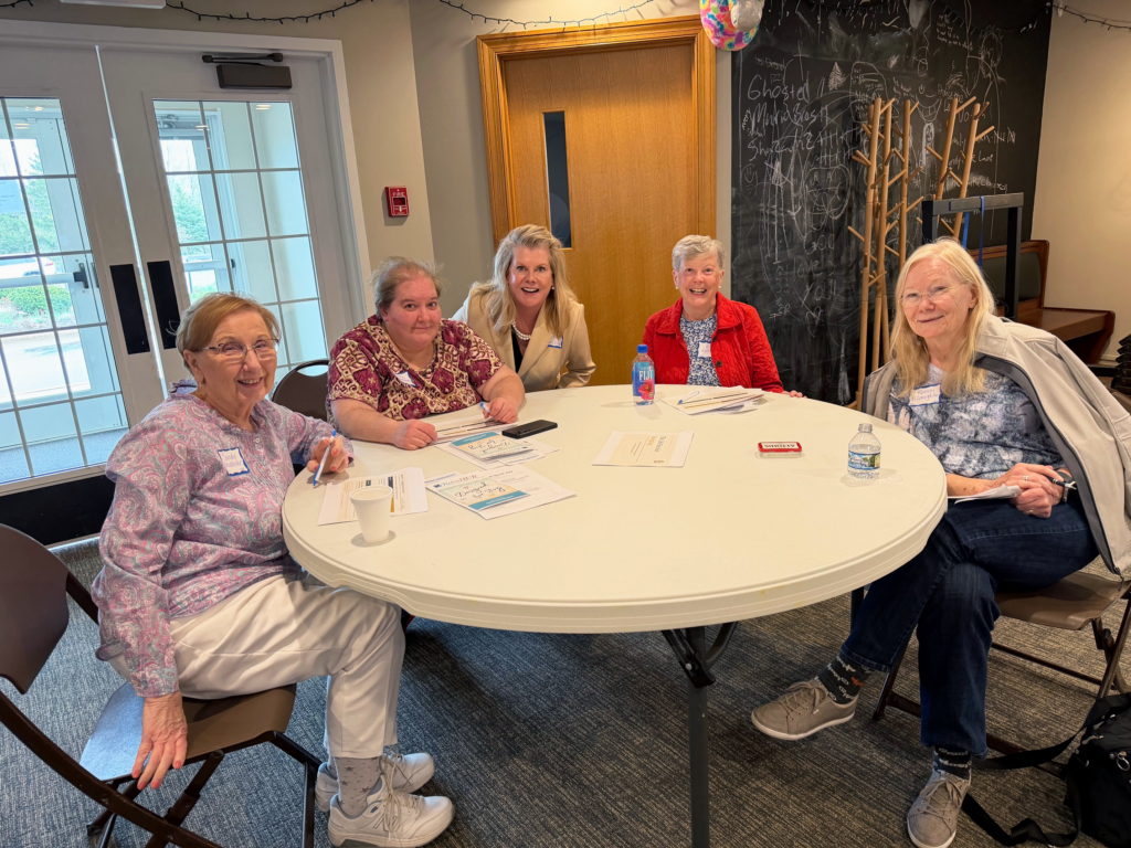 Women's Ministry members sitting together around a table.